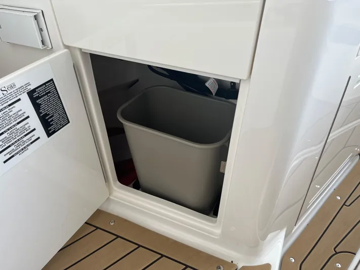 Lady Faby Yacht Photos Pics 2019 Sea Ray Sundancer 350 interior storage compartment with trash bin.