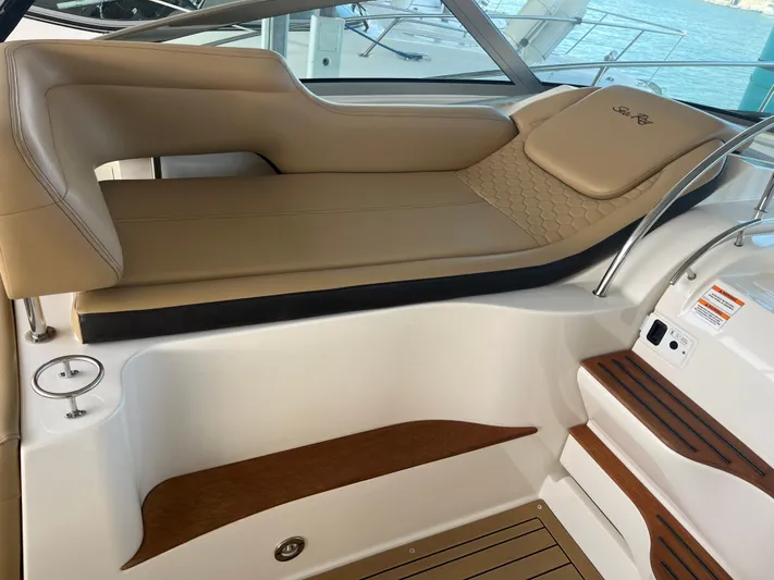 Lady Faby Yacht Photos Pics 2019 Sea Ray Sundancer 350 interior with tan seating and wooden accents.