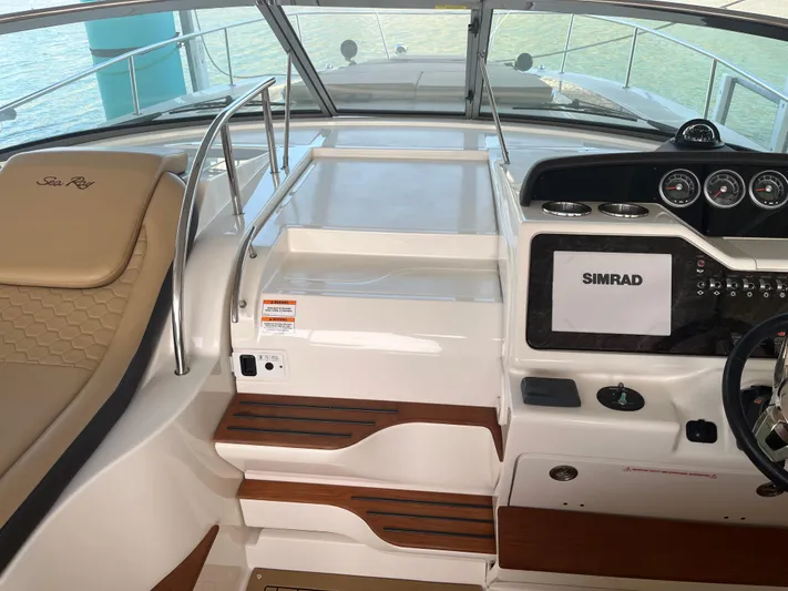 Lady Faby Yacht Photos Pics 2019 Sea Ray Sundancer 350 helm with Simrad navigation system and luxurious seating.