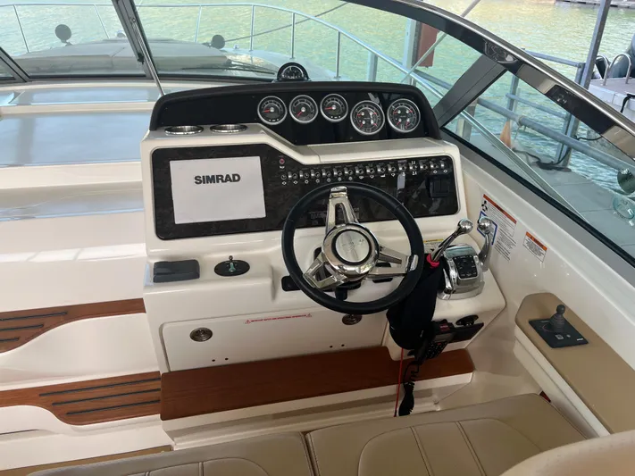 Lady Faby Yacht Photos Pics 2019 Sea Ray Sundancer 350 helm with Simrad navigation system and modern controls.