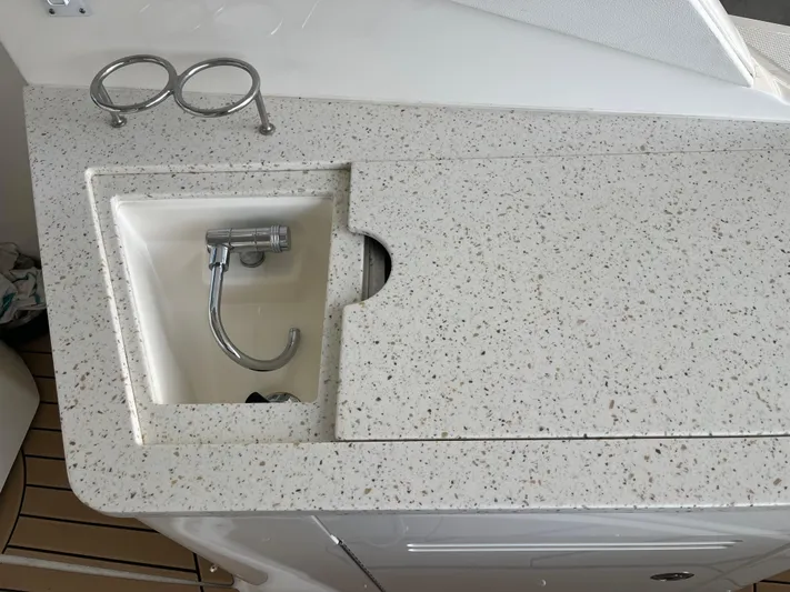 Lady Faby Yacht Photos Pics 2019 Sea Ray Sundancer 350 boat sink with speckled countertop and faucet.