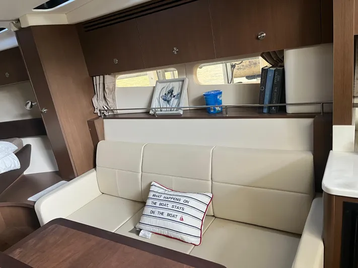 Lady Faby Yacht Photos Pics Interior of 2019 Sea Ray Sundancer 350 yacht with beige seating and decorative pillow.