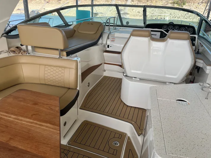 Lady Faby Yacht Photos Pics 2019 Sea Ray Sundancer 350 interior with beige seating and modern dashboard.