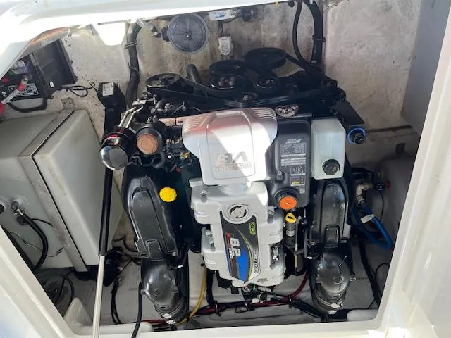  Yacht Photos Pics Engine compartment of a 2022 Monterey 295 Sport Yacht, showcasing a powerful inboard motor.