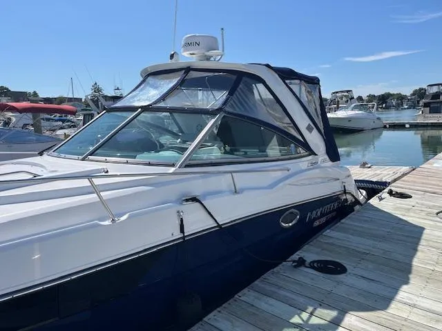  Yacht Photos Pics 2022 Monterey 295 Sport Yacht docked at marina under clear blue sky.