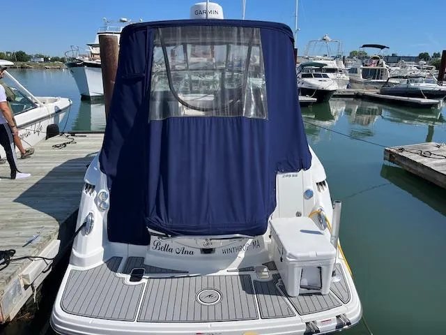  Yacht Photos Pics 2022 Monterey 295 Sport Yacht docked with blue cover, marina background.