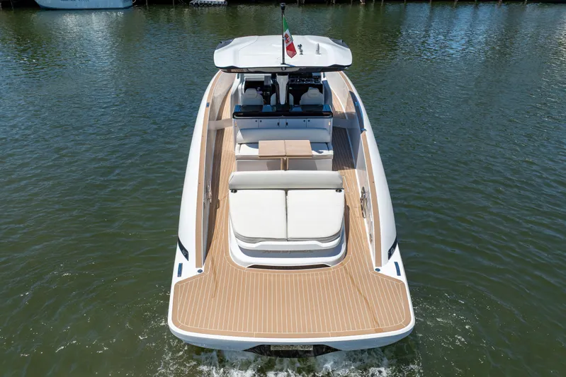  Yacht Photos Pics 2024 Solaris Power 40 Open yacht on water, rear view, elegant design, spacious deck.