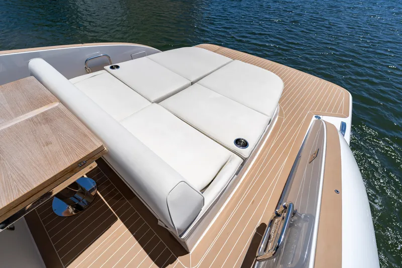  Yacht Photos Pics 2024 Solaris Power 40 Open yacht with luxurious sunbed and teak deck on water.