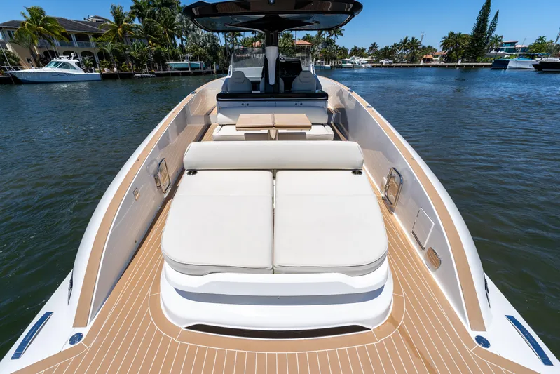  Yacht Photos Pics 2024 Solaris Power 40 Open yacht with spacious deck and luxurious seating on a sunny day.