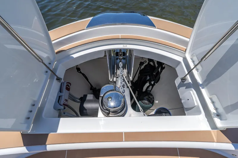  Yacht Photos Pics 2024 Solaris Power 40 Open yacht anchor compartment with open hatch, showcasing marine equipment.