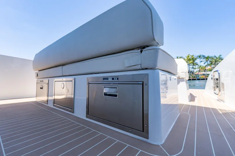  Yacht Photos Pics 2024 Solaris Power 40 Open yacht interior with sleek seating and storage compartments.