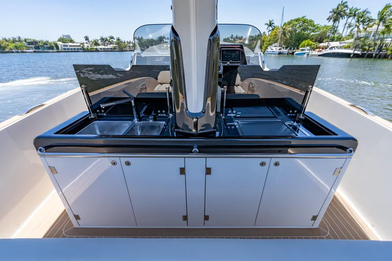  Yacht Photos Pics 2024 Solaris Power 40 Open yacht interior with sleek kitchen setup on a sunny day.