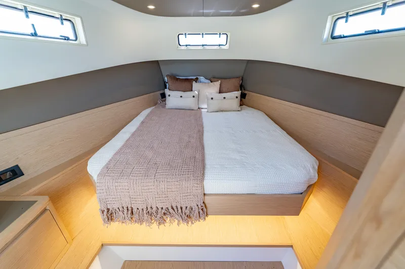  Yacht Photos Pics Luxurious cabin interior of 2024 Solaris Power 40 Open yacht, featuring a cozy bed and modern design.