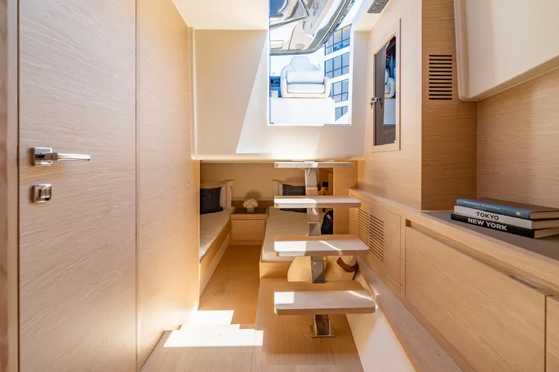  Yacht Photos Pics Luxurious interior of 2024 Solaris Power 40 Open yacht with modern wooden design and sleek staircase.