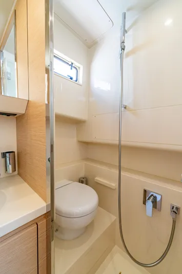  Yacht Photos Pics 2024 Solaris Power 40 Open yacht bathroom with modern fixtures and compact design.