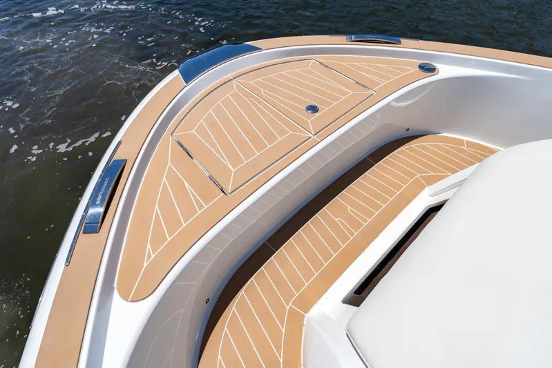  Yacht Photos Pics 2024 Solaris Power 40 Open yacht deck with elegant wood finish on water.
