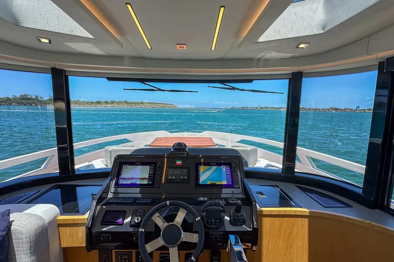 Da Mare Yacht Photos Pics Luxurious 2023 OKEAN 52 yacht cockpit with panoramic ocean view and advanced navigation systems.