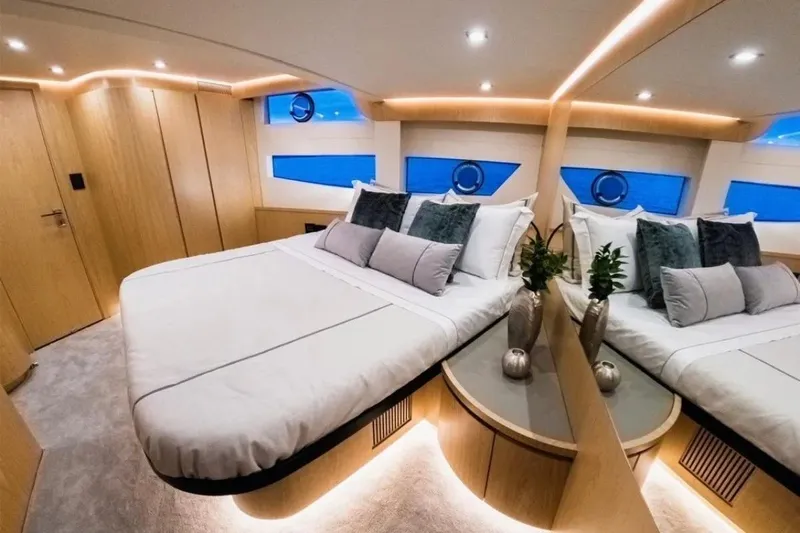 Da Mare Yacht Photos Pics Luxurious 2023 OKEAN 52 yacht bedroom with modern design and ambient lighting.