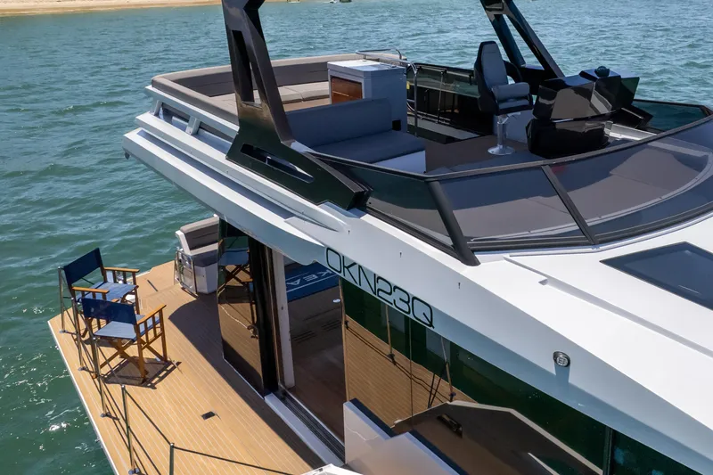 Da Mare Yacht Photos Pics 2023 OKEAN 52 yacht with spacious deck and modern design on the water.