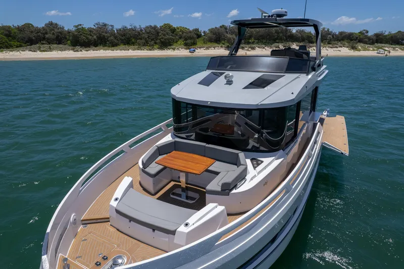 Da Mare Yacht Photos Pics 2023 OKEAN 52 yacht with sleek design, spacious deck, and luxurious seating on the water.