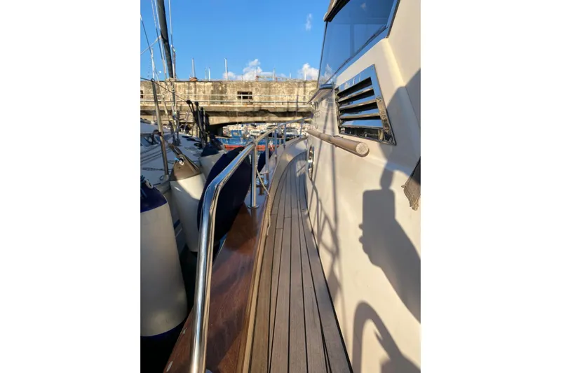  Yacht Photos Pics 2001 Apreamare Smeraldo 9 yacht deck with wooden finish and metal railings.