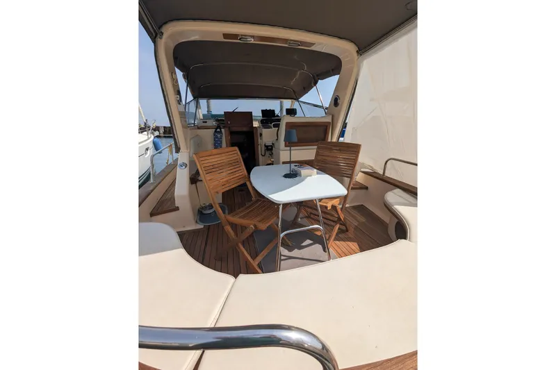  Yacht Photos Pics 2001 Apreamare Smeraldo 9 yacht interior with wooden chairs and table.