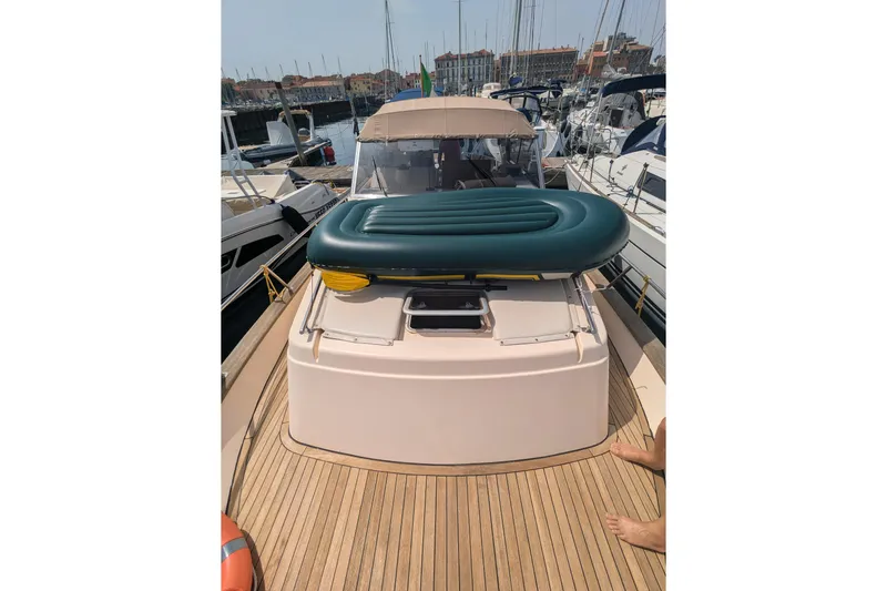  Yacht Photos Pics 2001 Apreamare Smeraldo 9 yacht with inflatable mattress on deck, docked in marina.