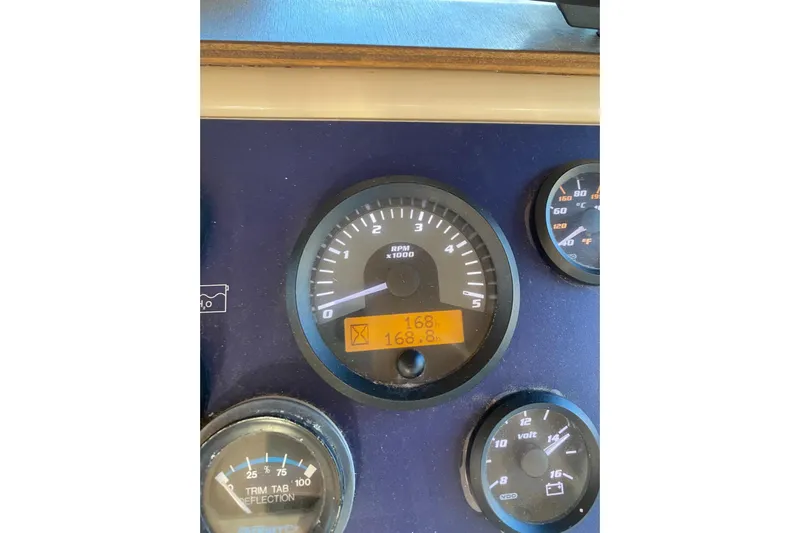  Yacht Photos Pics Dashboard gauges of a 2001 Apreamare Smeraldo 9 boat, displaying RPM and other metrics.