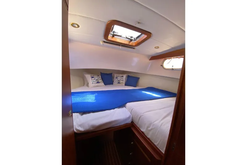  Yacht Photos Pics Cozy cabin interior of 2001 Apreamare Smeraldo 9 yacht with blue accents.