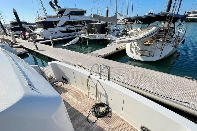 Angelina Yacht Photos Pics Monte Fino 73 yacht docked at marina, 2005 model, with surrounding boats.