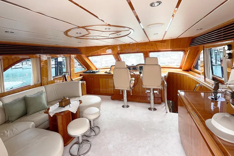 Angelina Yacht Photos Pics Luxurious interior of 2005 Monte Fino 73 yacht with elegant seating and helm station.