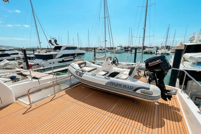 Angelina Yacht Photos Pics Monte Fino 73 yacht deck with Highfield tender, docked in a marina, 2005 model.