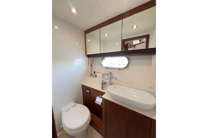 Ohana Yacht Photos Pics Luxurious bathroom in 2012 Sunseeker Manhattan 73 yacht with modern fixtures and elegant design.