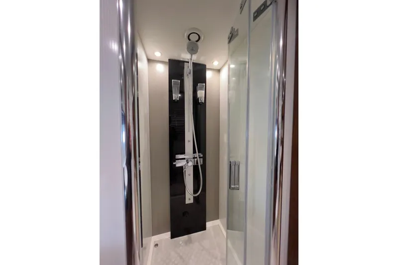 Ohana Yacht Photos Pics Luxurious shower in 2012 Sunseeker Manhattan 73 yacht, featuring modern fixtures and sleek design.