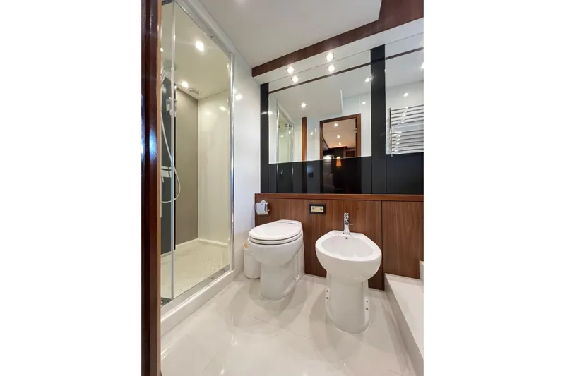 Ohana Yacht Photos Pics Luxurious bathroom on 2012 Sunseeker Manhattan 73 yacht with shower, toilet, and bidet.