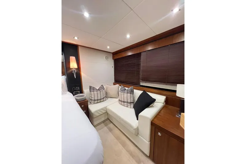 Ohana Yacht Photos Pics Luxurious interior of 2012 Sunseeker Manhattan 73 yacht with cozy seating area.