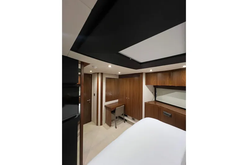 Ohana Yacht Photos Pics Luxurious interior of 2012 Sunseeker Manhattan 73 yacht with elegant wood finishes.