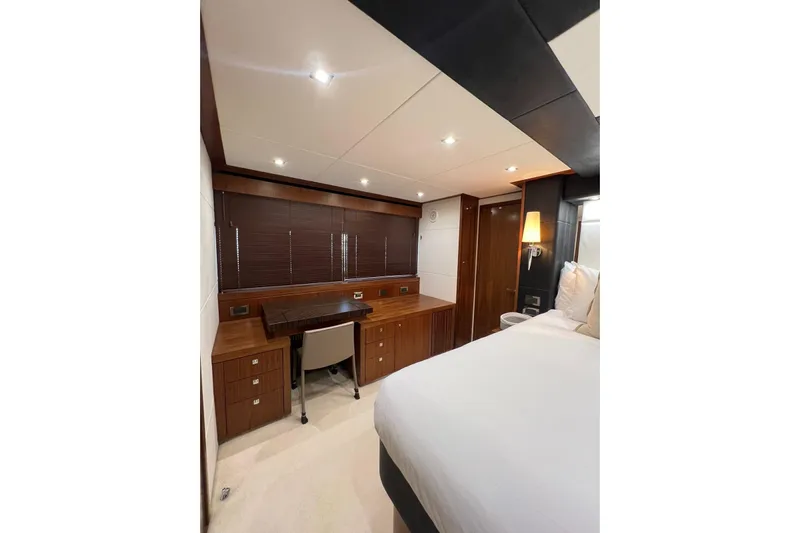 Ohana Yacht Photos Pics Luxurious cabin interior of 2012 Sunseeker Manhattan 73 yacht with elegant wood finishes.