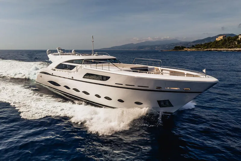 Fast & Furious Yacht Photos Pics Luxurious 2016 AB 145 yacht cruising on open sea near scenic coastline.