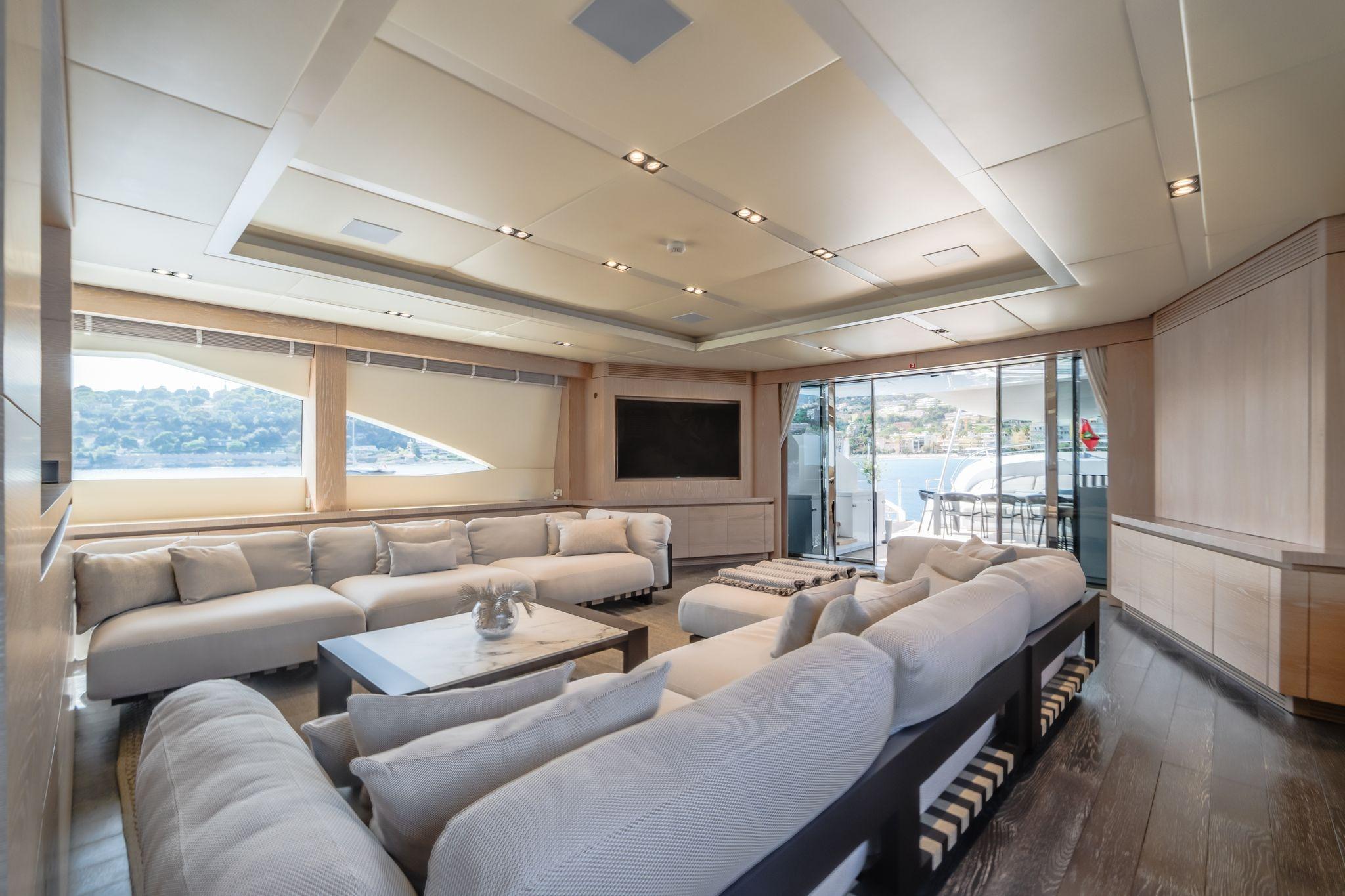 Luxurious yacht interior with plush seating, large windows, and modern design, AB 145, 2016 model.