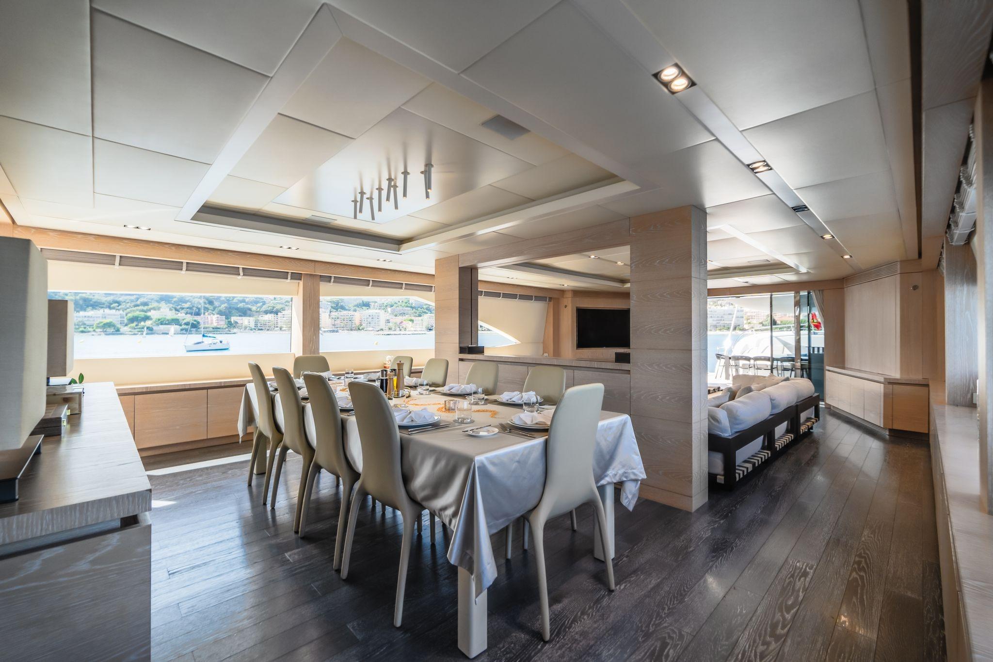 Luxurious dining area on 2016 AB 145 yacht with elegant furnishings and scenic views.