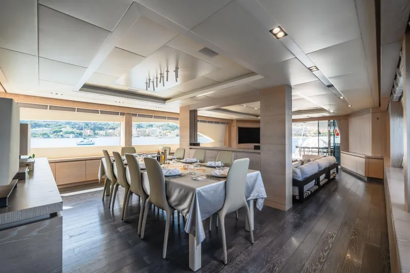Fast & Furious Yacht Photos Pics Luxurious dining area on 2016 AB 145 yacht with elegant furnishings and scenic views.