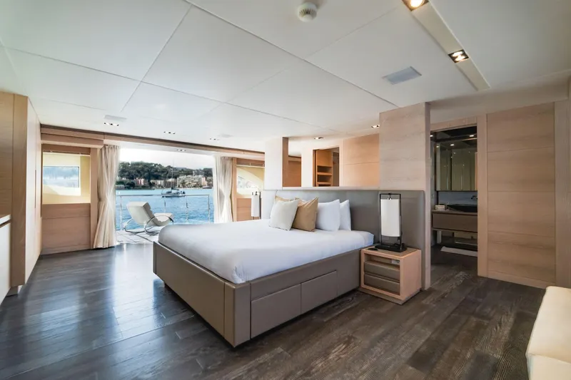 Fast & Furious Yacht Photos Pics Luxurious yacht bedroom with modern decor, large windows, and scenic ocean view. AB 145, 2016 model.