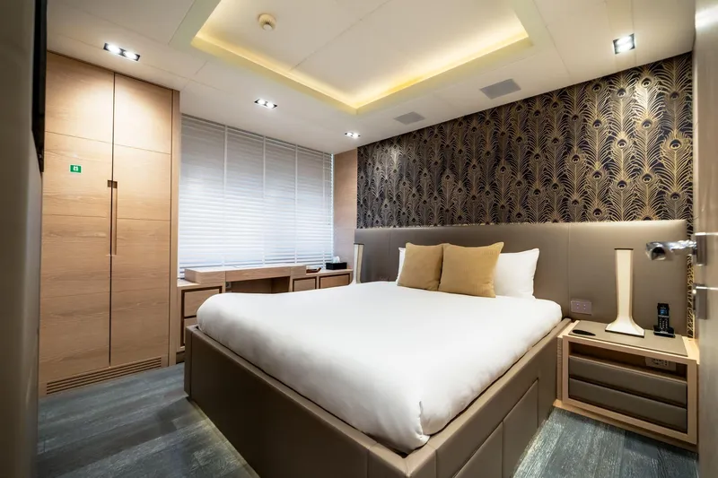 Fast & Furious Yacht Photos Pics Luxurious bedroom with modern decor, featuring elegant wallpaper and ambient lighting, AB 145, 2016.