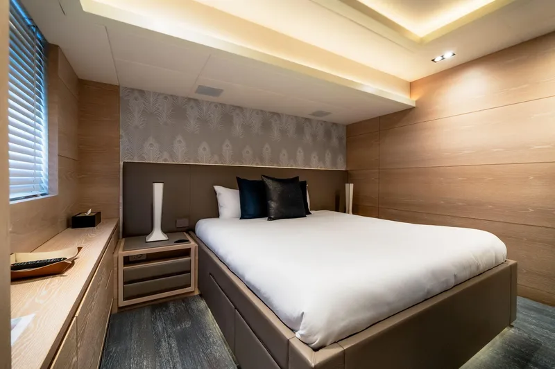 Fast & Furious Yacht Photos Pics Luxurious bedroom interior on AB 145 yacht, 2016 model, featuring modern design and elegant decor.