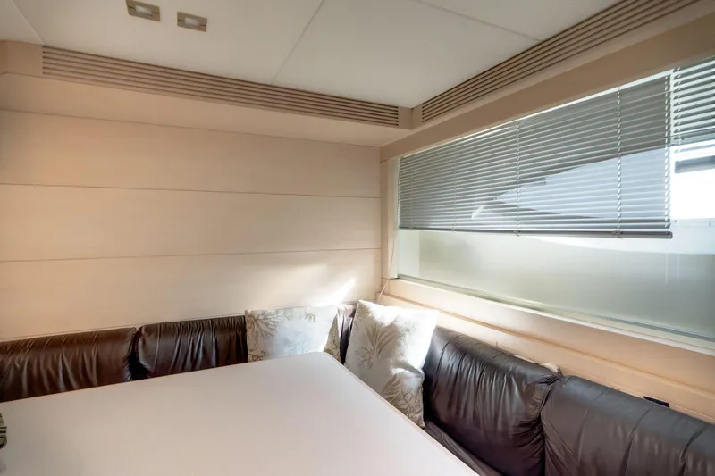 Fast & Furious Yacht Photos Pics Luxurious interior of 2016 AB 145 yacht with leather seating and large window blinds.