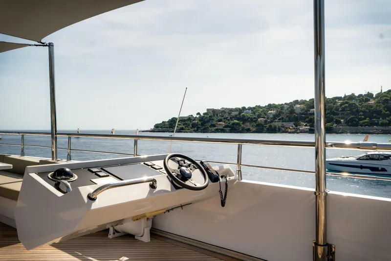 Fast & Furious Yacht Photos Pics Luxury yacht AB 145 (2016) helm with scenic ocean view and distant coastline.