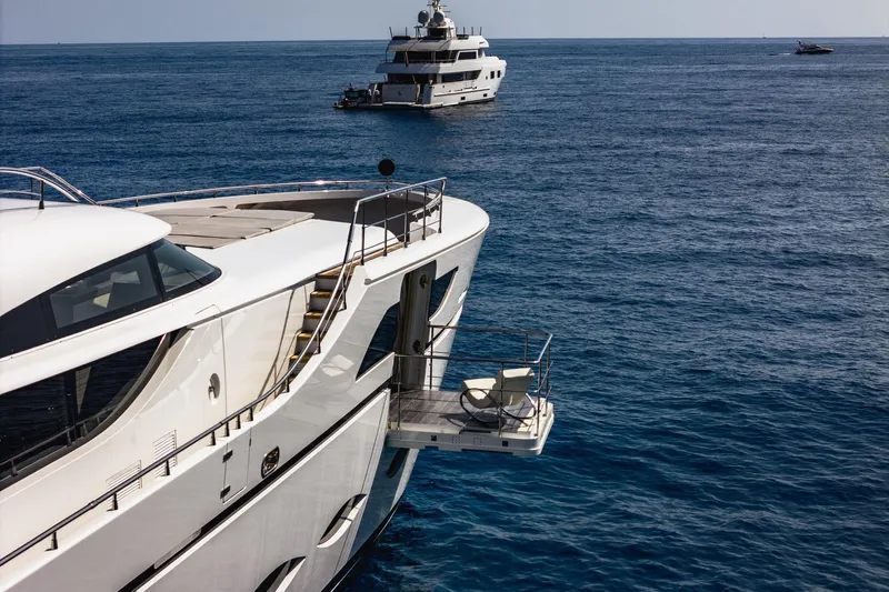 Fast & Furious Yacht Photos Pics Luxury yacht AB 145 (2016) on serene ocean with distant vessels.