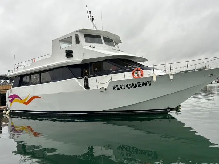 Eloquent Yacht Photos Pics Palmer Marine 70 Pilothouse yacht, 1990, named "Eloquent" docked on calm water.