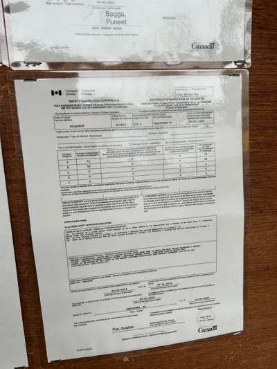 Eloquent Yacht Photos Pics Document displayed on a wooden surface, related to Palmer Marine 70 Pilothouse, 1990.